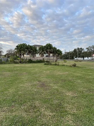 a view of a lake with houses in the back
