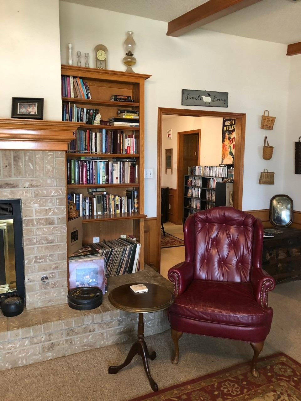 908 West 5th Street Post, TX 79356 - Photo 7 of 26 a living room with furniture and a book shelf