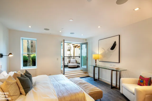 a bedroom with furniture and a window