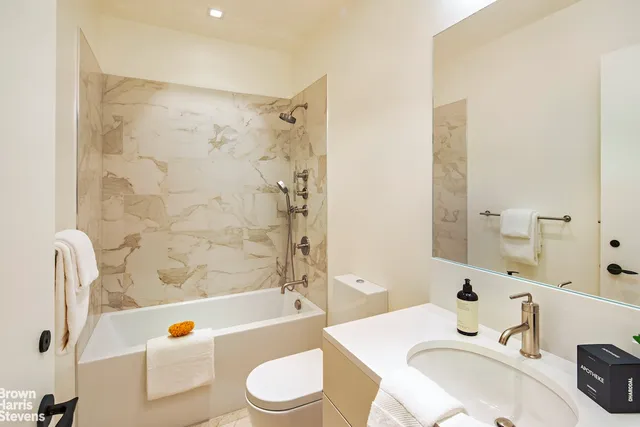 a bathroom with a sink a toilet and a bathtub