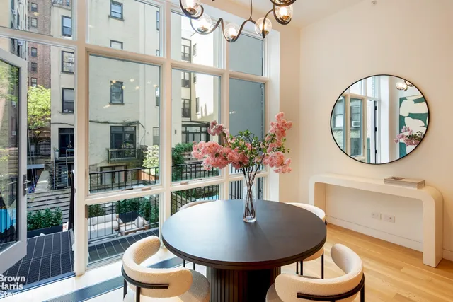 a view of a livingroom with furniture and a potted plant