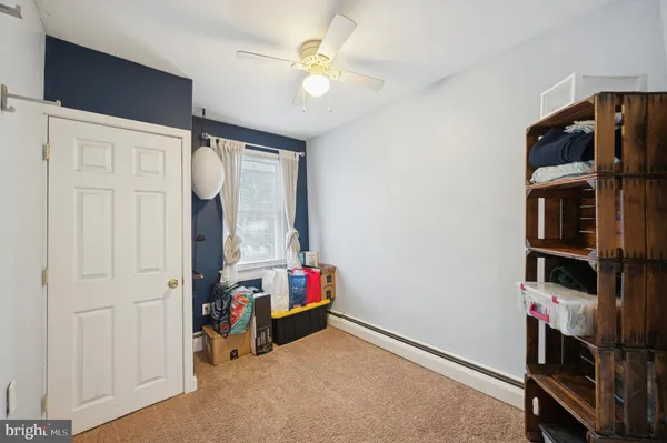 a view of room with workspace and stairs