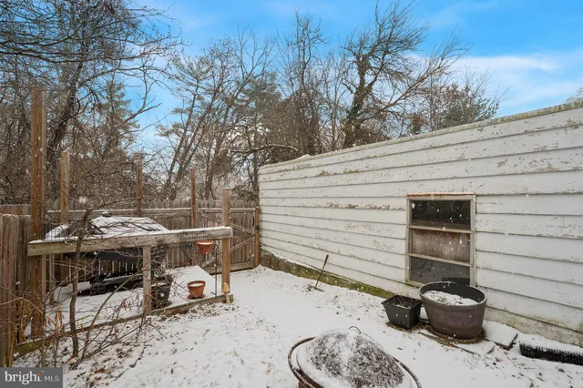 a view of a patio with iron fence