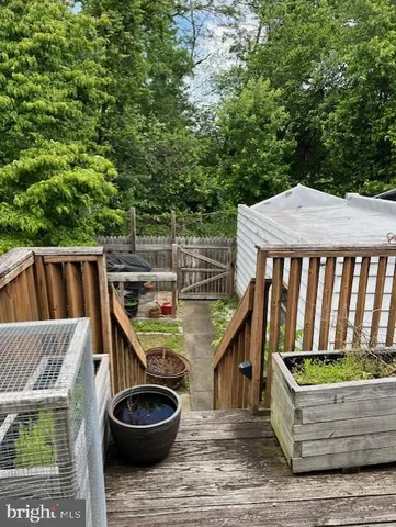 a backyard of a house with fire pit and outdoor seating