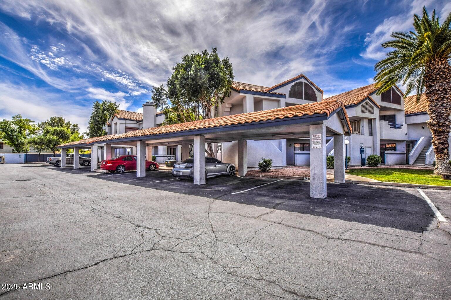 1800 West Elliot Road, Unit 227 Chandler, AZ 85224 - Photo 27 of 27 a view of a house with swimming pool and a yard