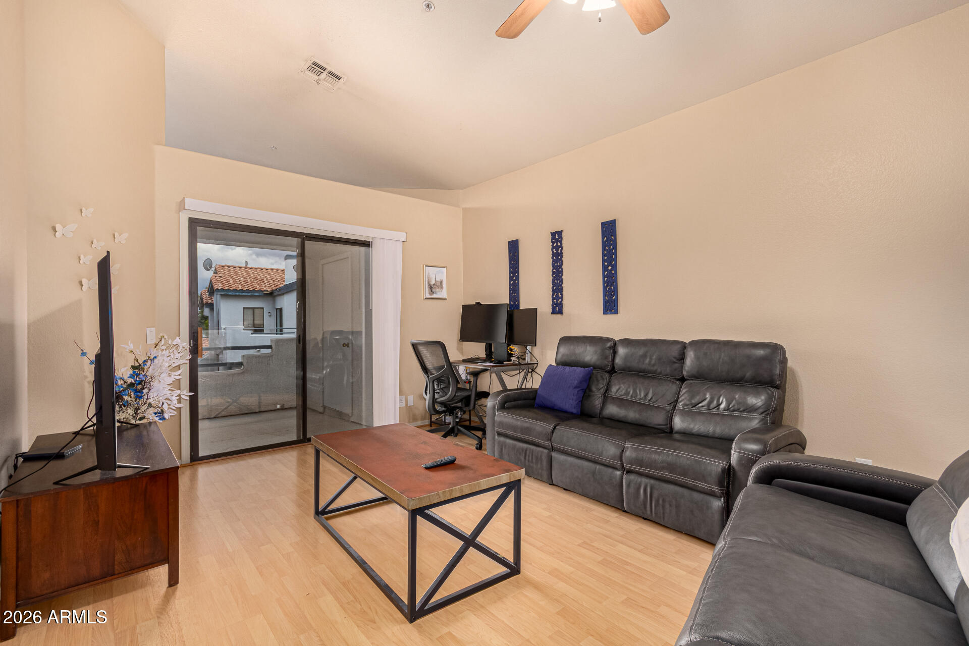 1800 West Elliot Road, Unit 227 Chandler, AZ 85224 - Photo 3 of 27 a living room with furniture and a flat screen tv