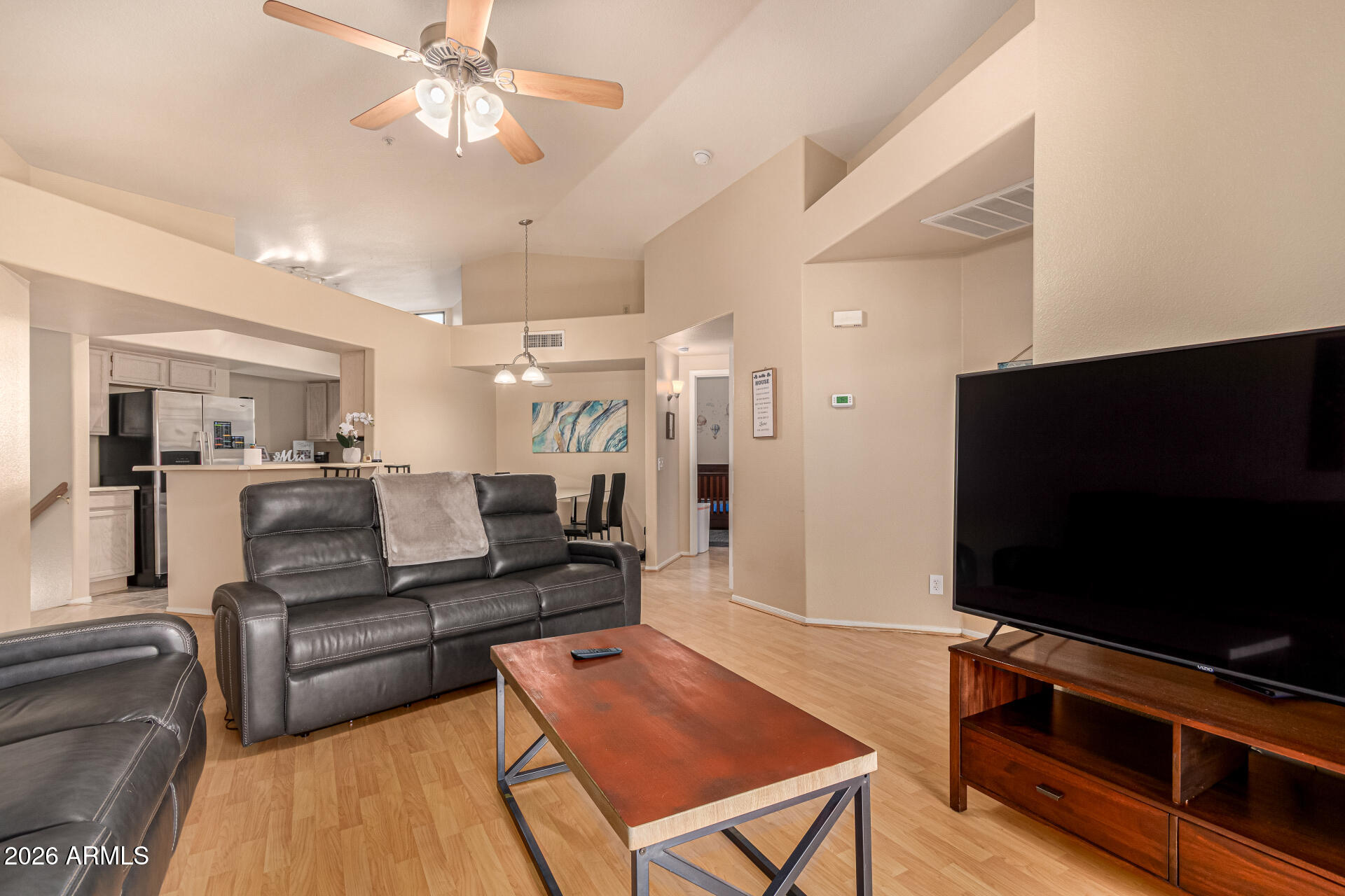 1800 West Elliot Road, Unit 227 Chandler, AZ 85224 - Photo 4 of 27 a living room with furniture and a flat screen tv