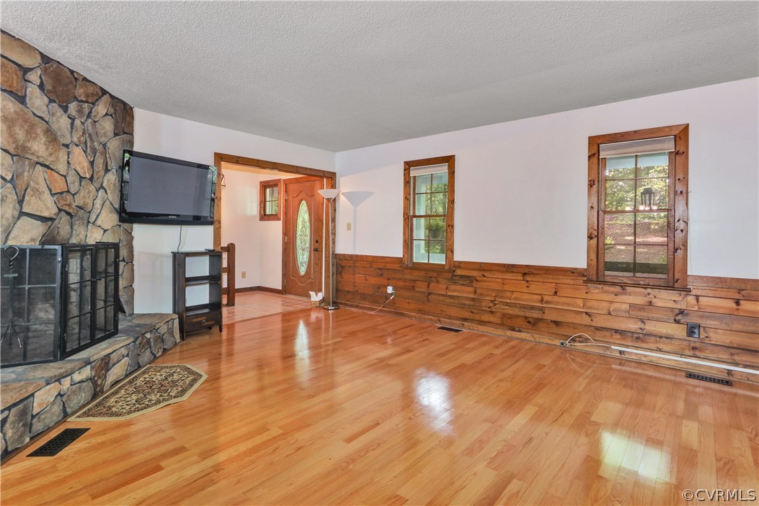 12303 Bailey Bridge Road Midlothian, VA 23112 - Photo 6 of 28 a view of empty room with wooden floor and fan