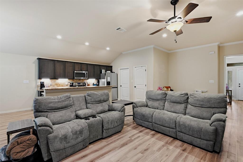 3020 West Loy Lake Road Denison, TX 75020 - Photo 6 of 32 You can push the couches back for more space or bring them in to get cozy for movie night.