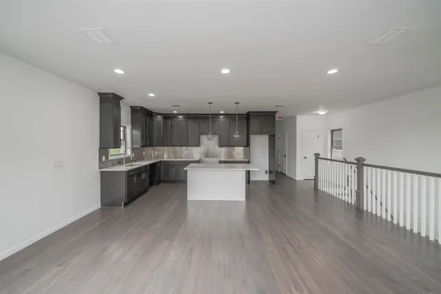a view of kitchen with wooden floor