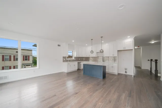 a view of kitchen with wooden floor