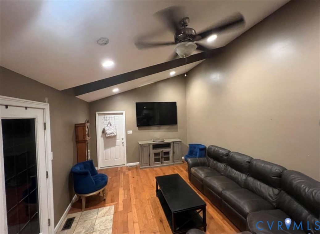 1151 Cartersville Road Cartersville, VA 23027 - Photo 4 of 14 a living room with furniture and a flat screen tv