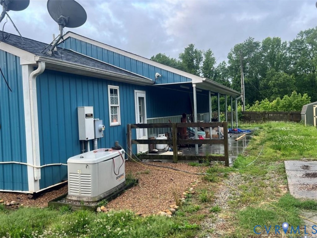 1151 Cartersville Road Cartersville, VA 23027 - Photo 9 of 14 a view of a backyard with sitting area and furniture