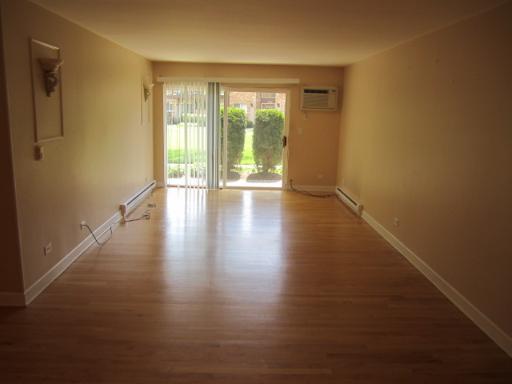834 East Old Willow Road, Unit 109 Prospect Heights, IL 60070 - Photo 4 of 10 a view of empty room with wooden floor and fan