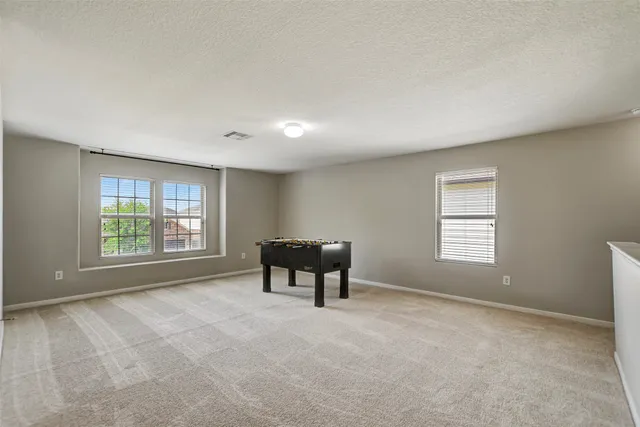 a view of room with ceiling fan