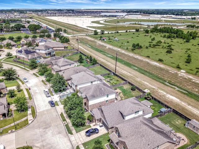 an aerial view of residential houses with outdoor space