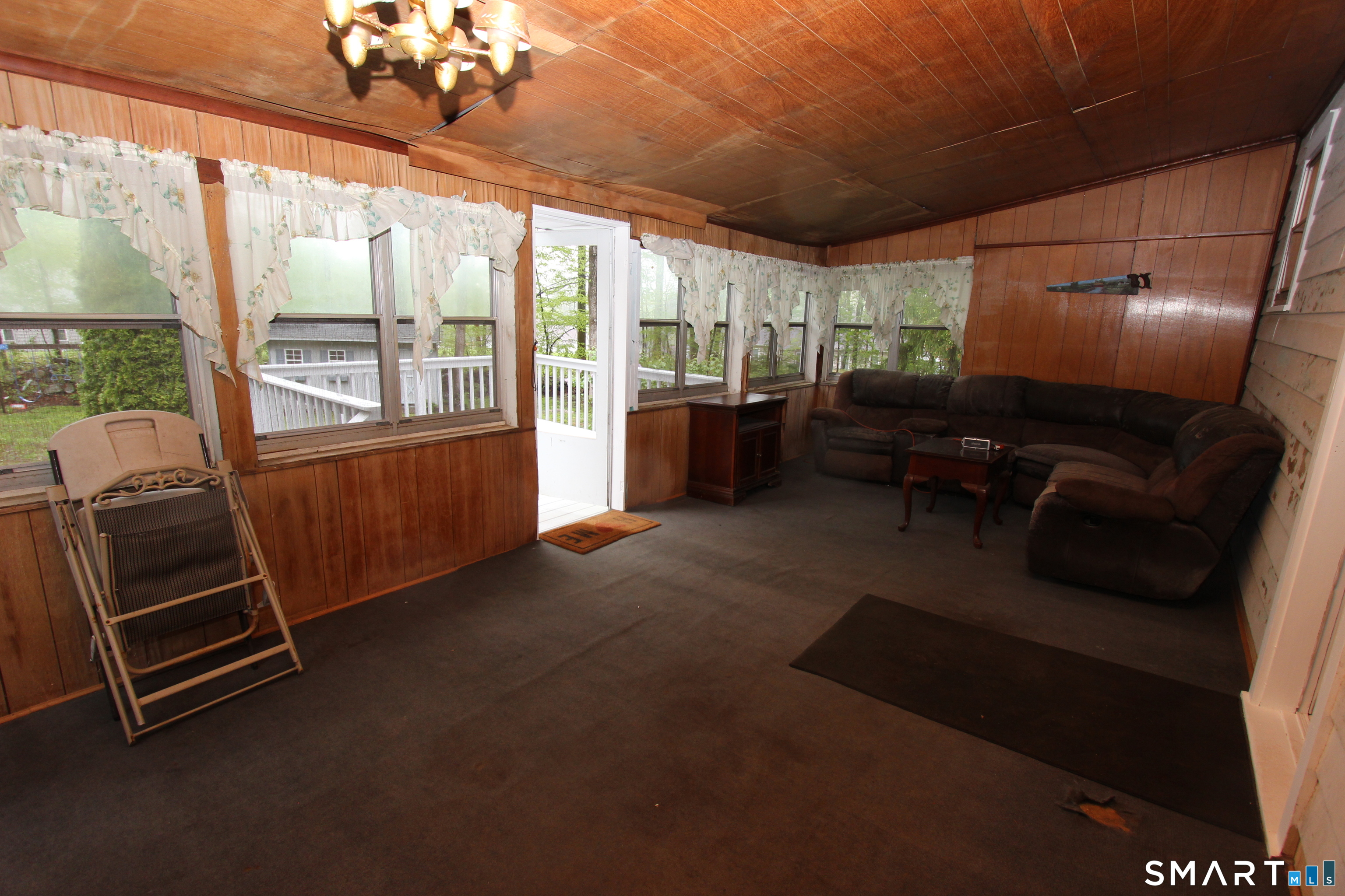 22 Brook Street Seymour, CT 06483 - Photo 13 of 13 a living room with furniture and a flat screen tv