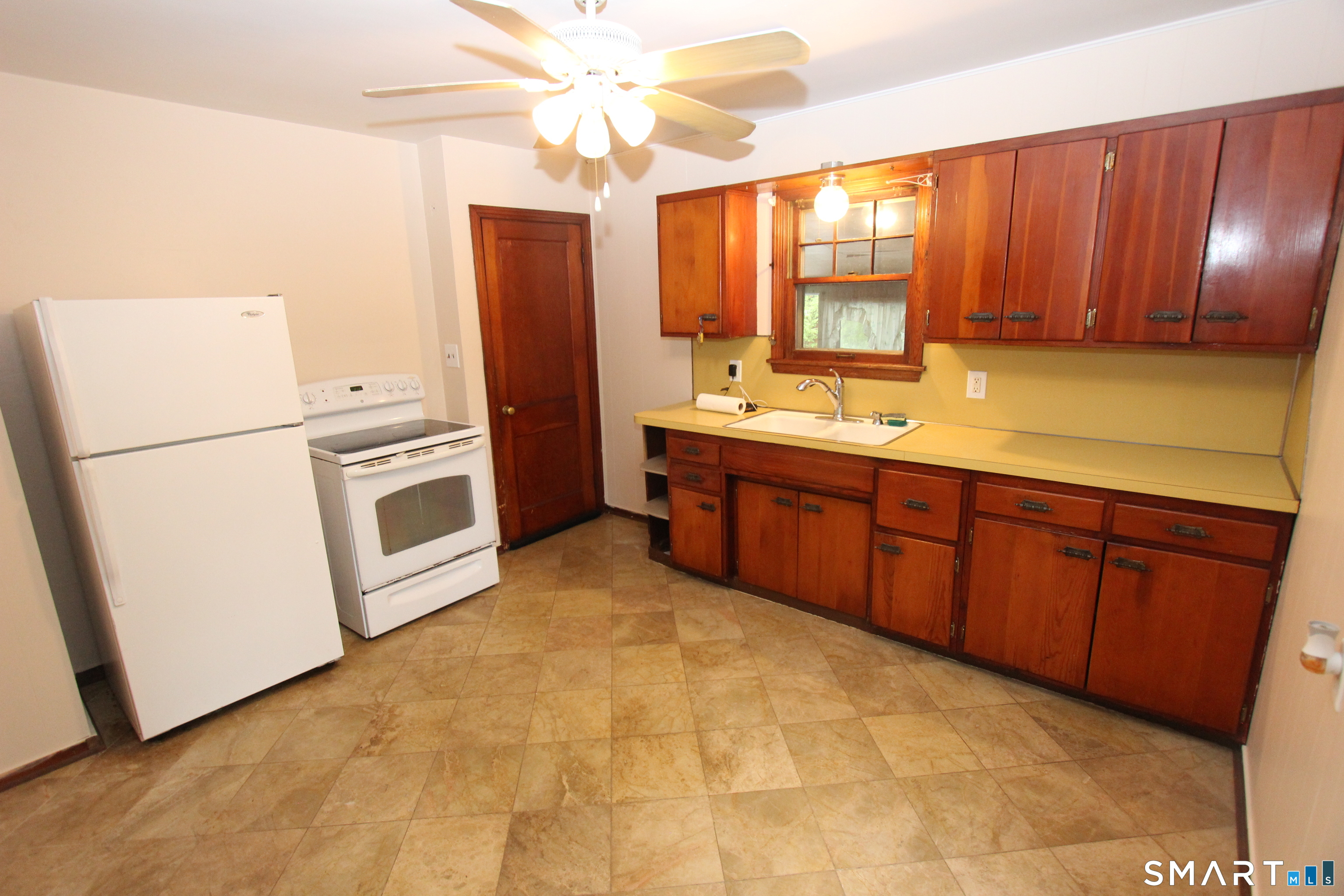 22 Brook Street Seymour, CT 06483 - Photo 4 of 13 a kitchen with stainless steel appliances granite countertop a stove a refrigerator a sink and dishwasher