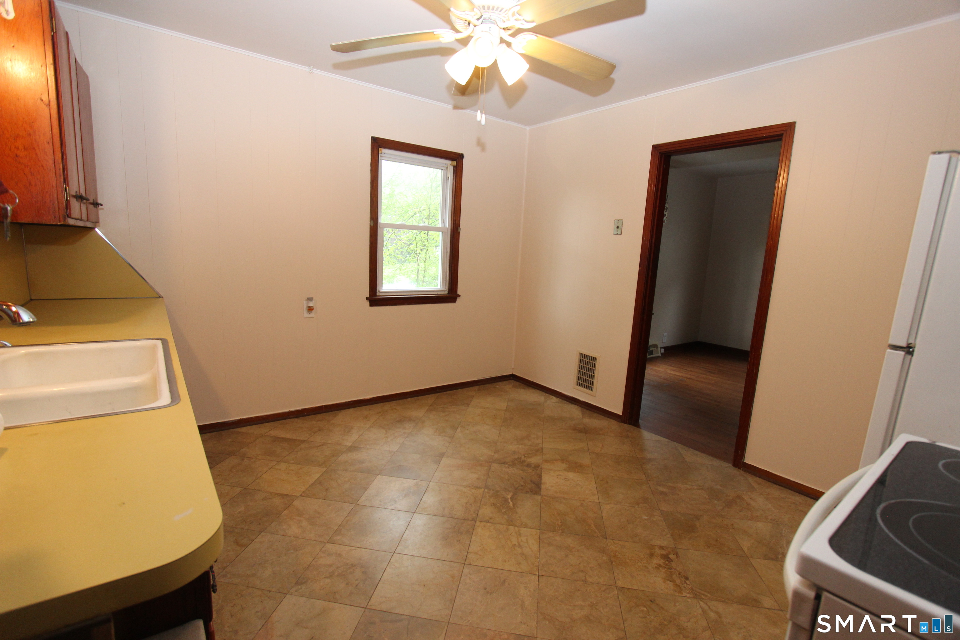 22 Brook Street Seymour, CT 06483 - Photo 5 of 13 a view of a livingroom with a stove and a window