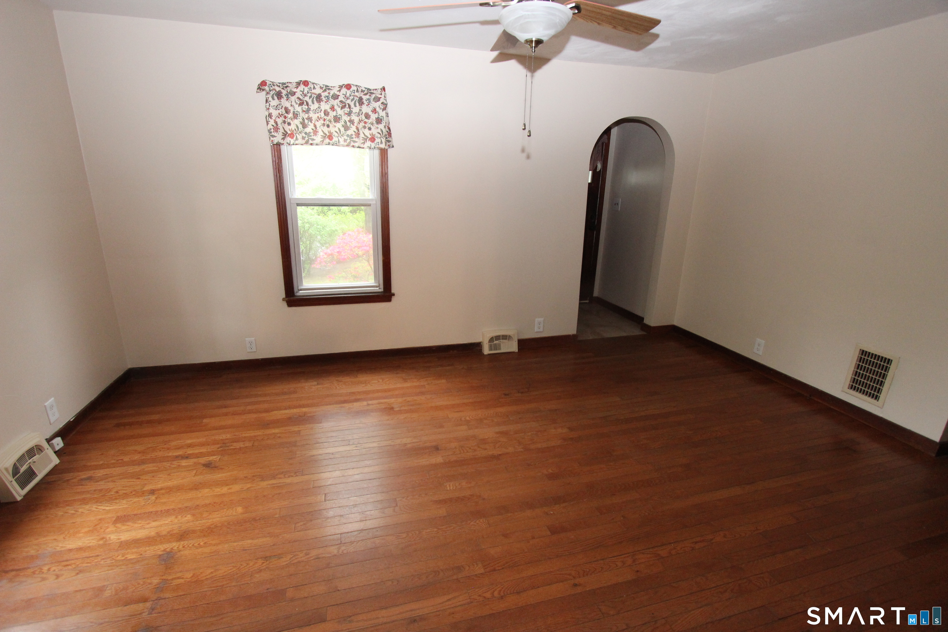 22 Brook Street Seymour, CT 06483 - Photo 6 of 13 an empty room with wooden floor and window