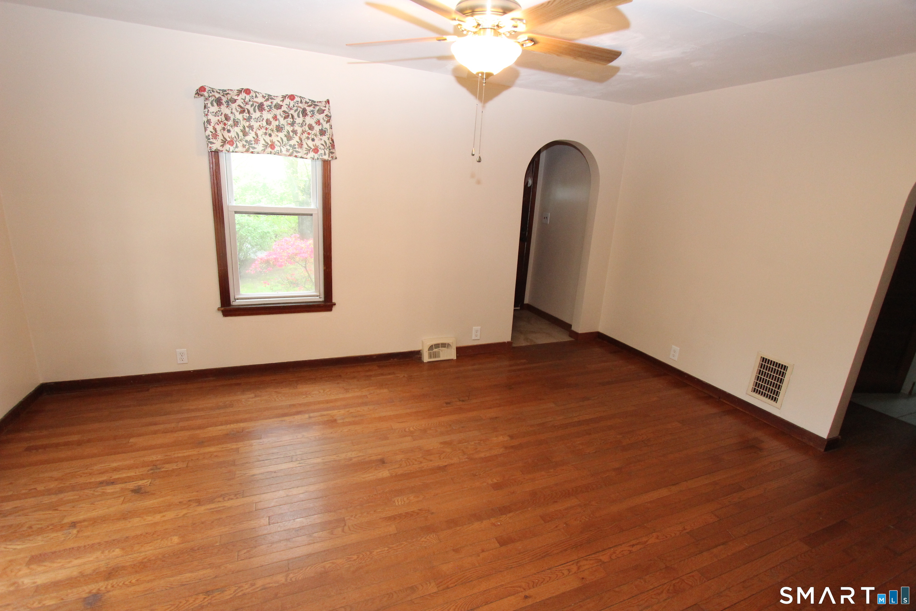 22 Brook Street Seymour, CT 06483 - Photo 8 of 13 an empty room with wooden floor and windows