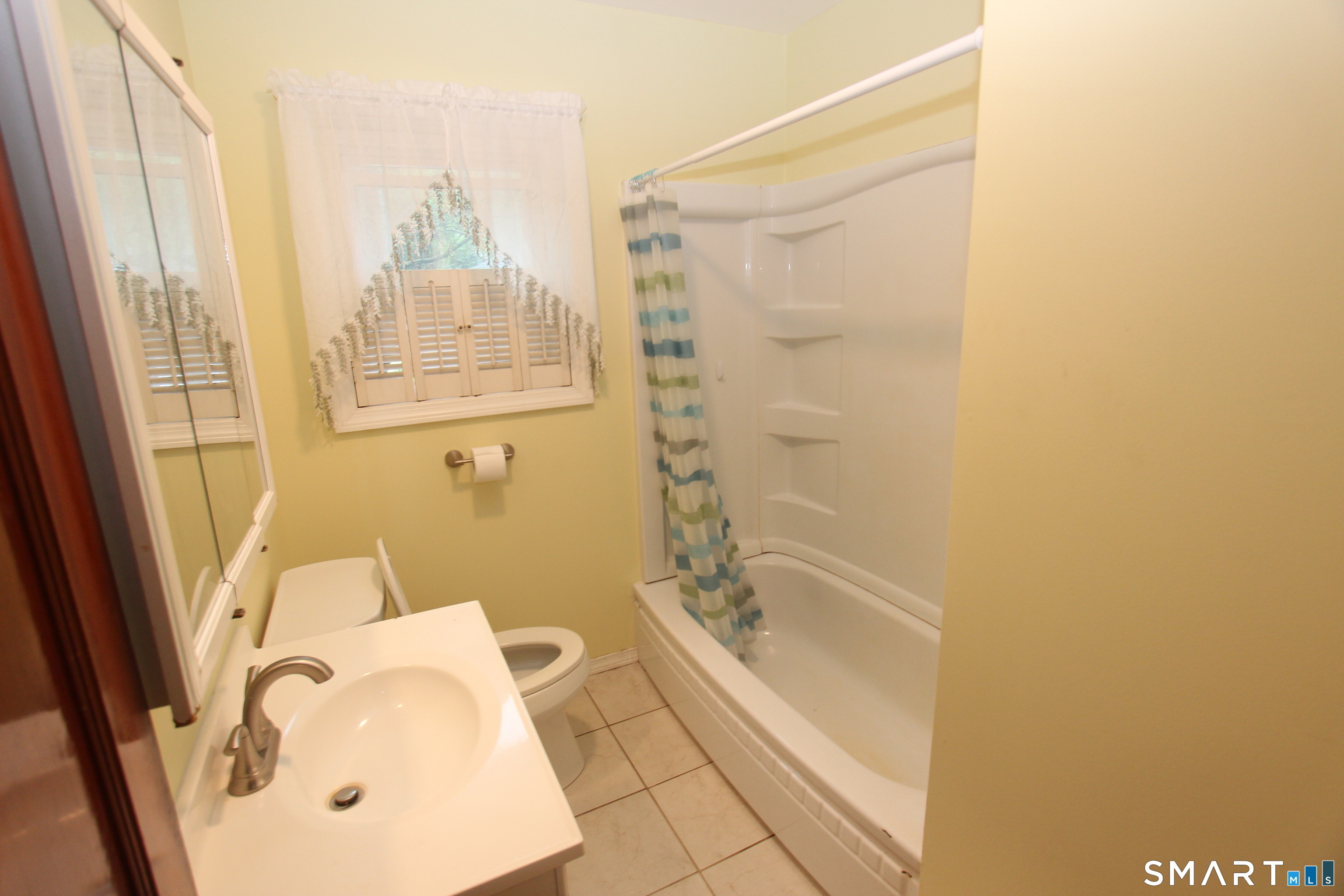22 Brook Street Seymour, CT 06483 - Photo 10 of 13 a bathroom with a tub a sink and a window