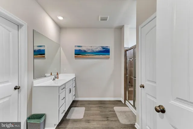 a bathroom with a sink and mirror