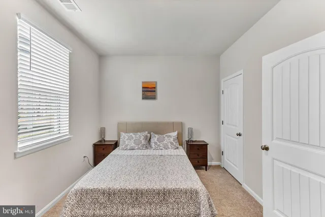 a bedroom with a bed and furniture