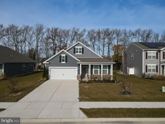a view of a house with a snow in the yard