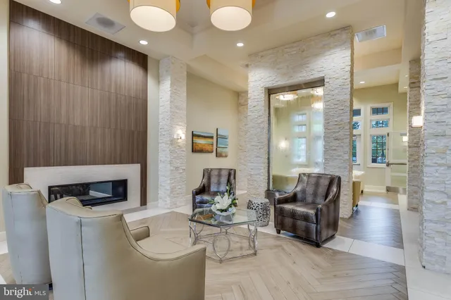 a room with pool table and windows