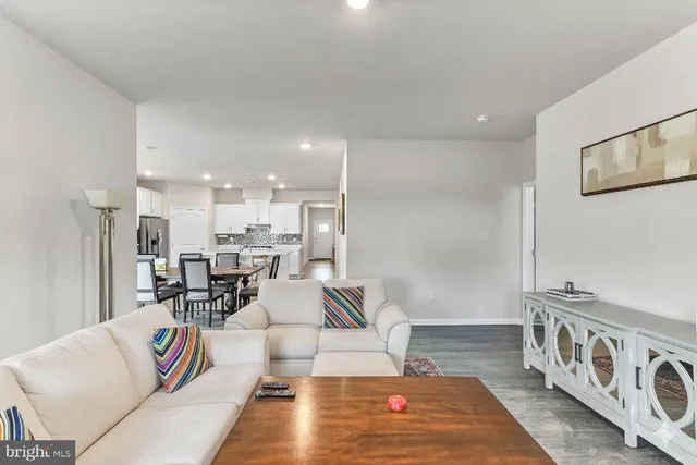 a living room with furniture and a rug