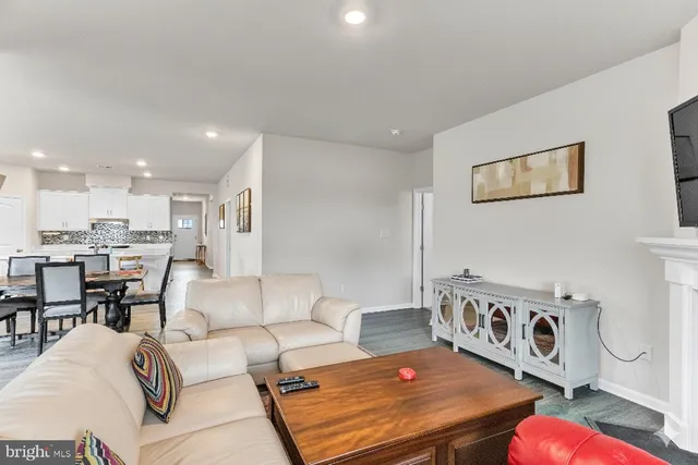 a living room with furniture and a table