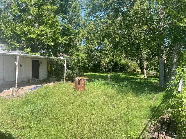 a backyard of a house with seating space