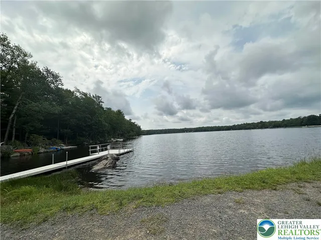 a view of a lake with a yard