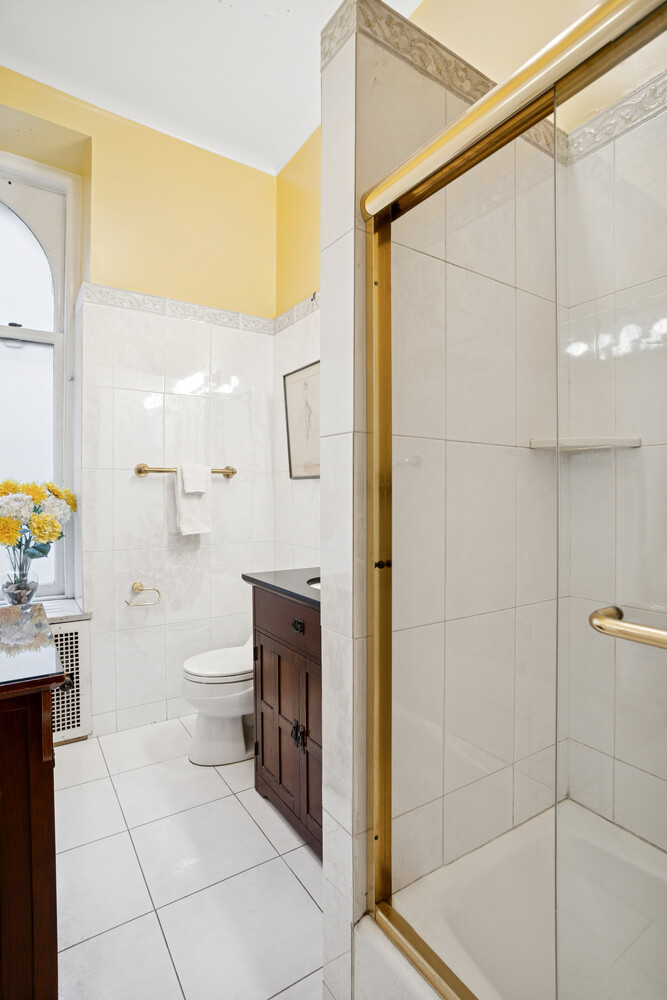 390 West End Avenue, Unit 3DN Manhattan, NY 10024 - Photo 7 of 8 a bathroom with a shower and a toilet