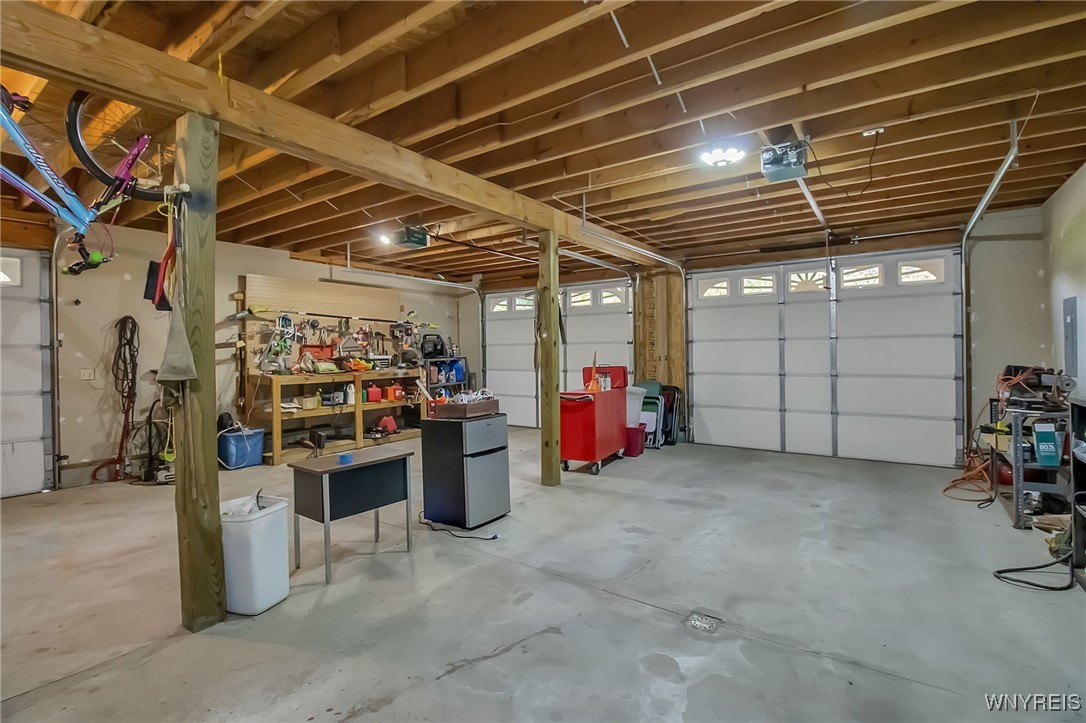 6553 Vermont Hill Road Wales, NY 14139 - Photo 47 of 50 inside of 3.5 car garage