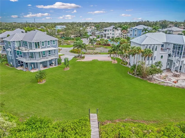 a view of a city with tall buildings and a big yard