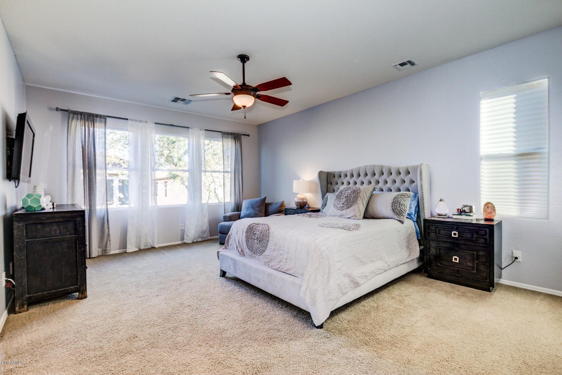 9121 South Roberts Road Tempe, AZ 85284 - Photo 16 of 36 a spacious bedroom with a bed and a window