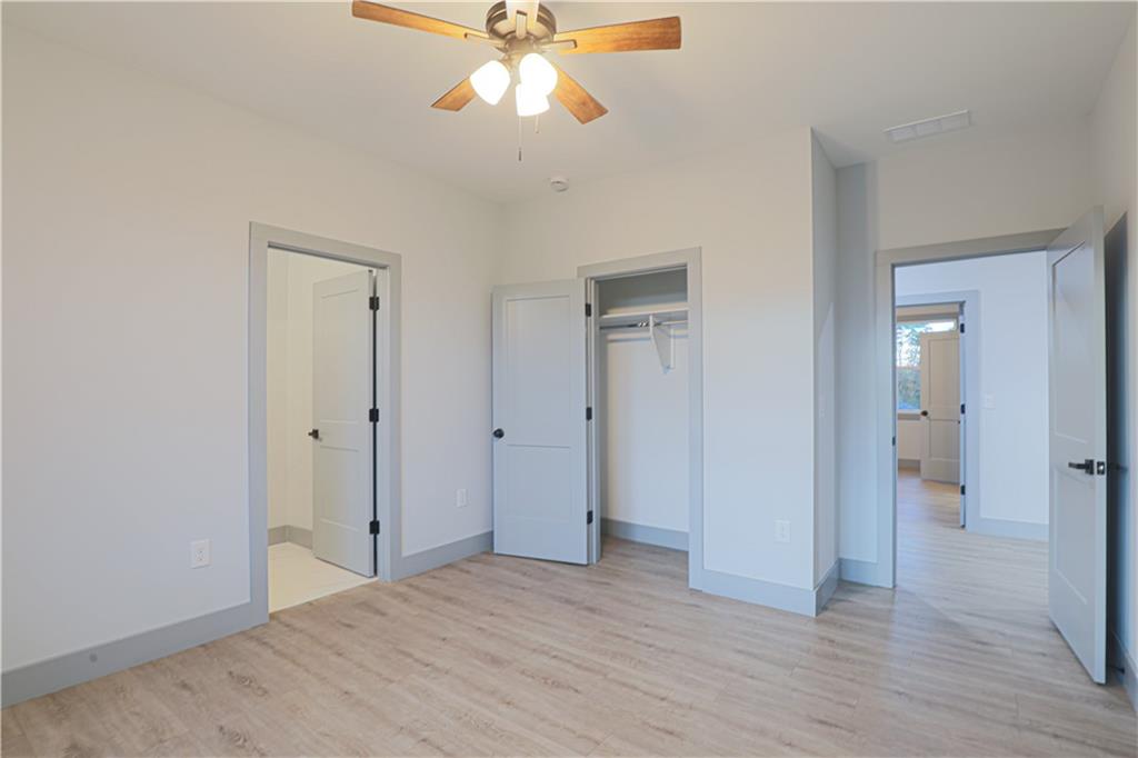 1341 Wheeler Creek Road Maysville, GA 30558 - Photo 33 of 51 a view of an empty room with wooden floor