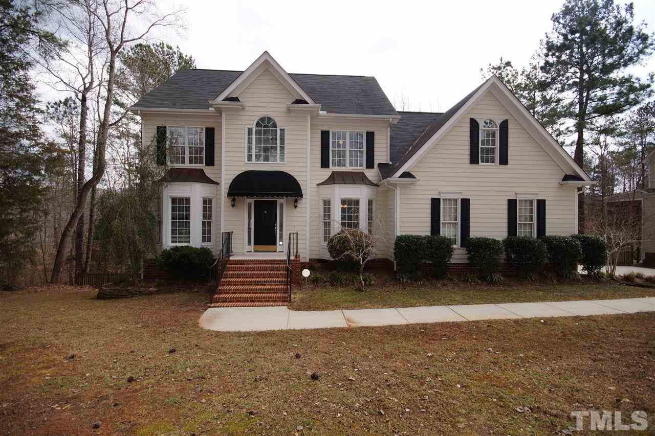 12736 Amoretto Way Raleigh, NC 27613 - Photo 1 of 25 a front view of a house with a yard