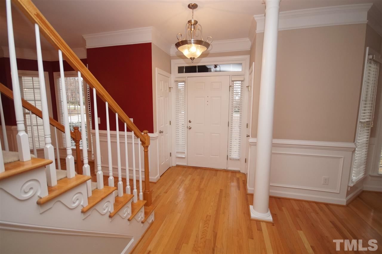 12736 Amoretto Way Raleigh, NC 27613 - Photo 2 of 25 a view of entryway and hall with wooden floor