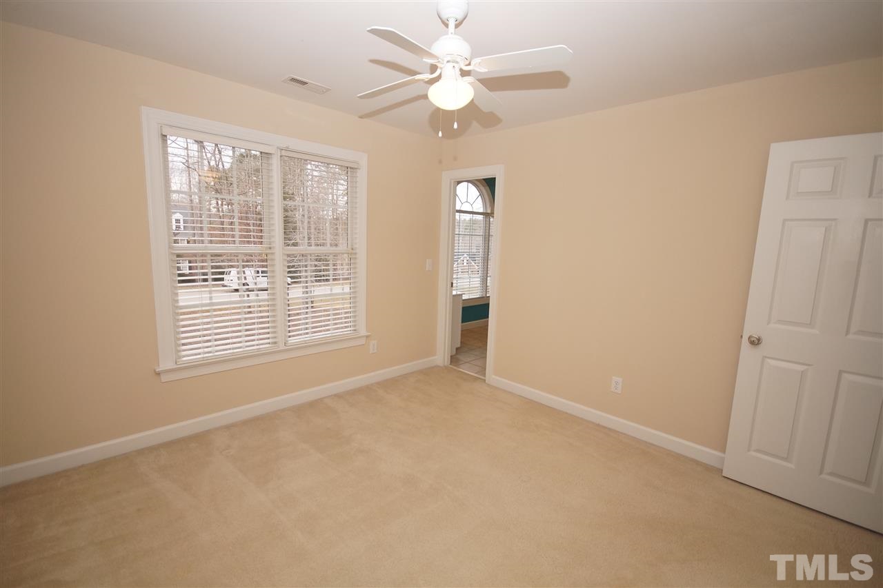 12736 Amoretto Way Raleigh, NC 27613 - Photo 22 of 25 a view of an empty room with a window