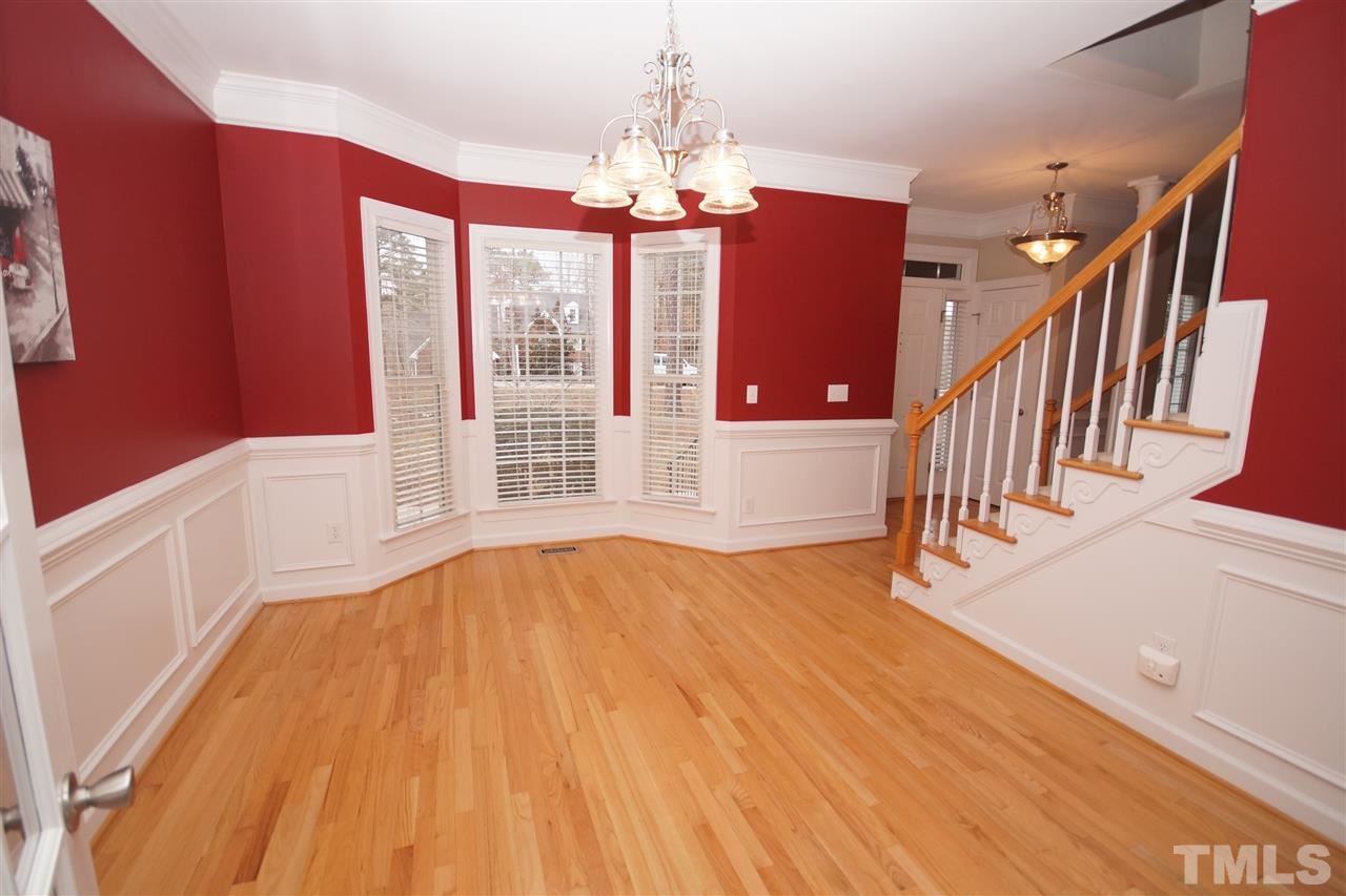 12736 Amoretto Way Raleigh, NC 27613 - Photo 4 of 25 a view of livingroom with hardwood floor and hallway