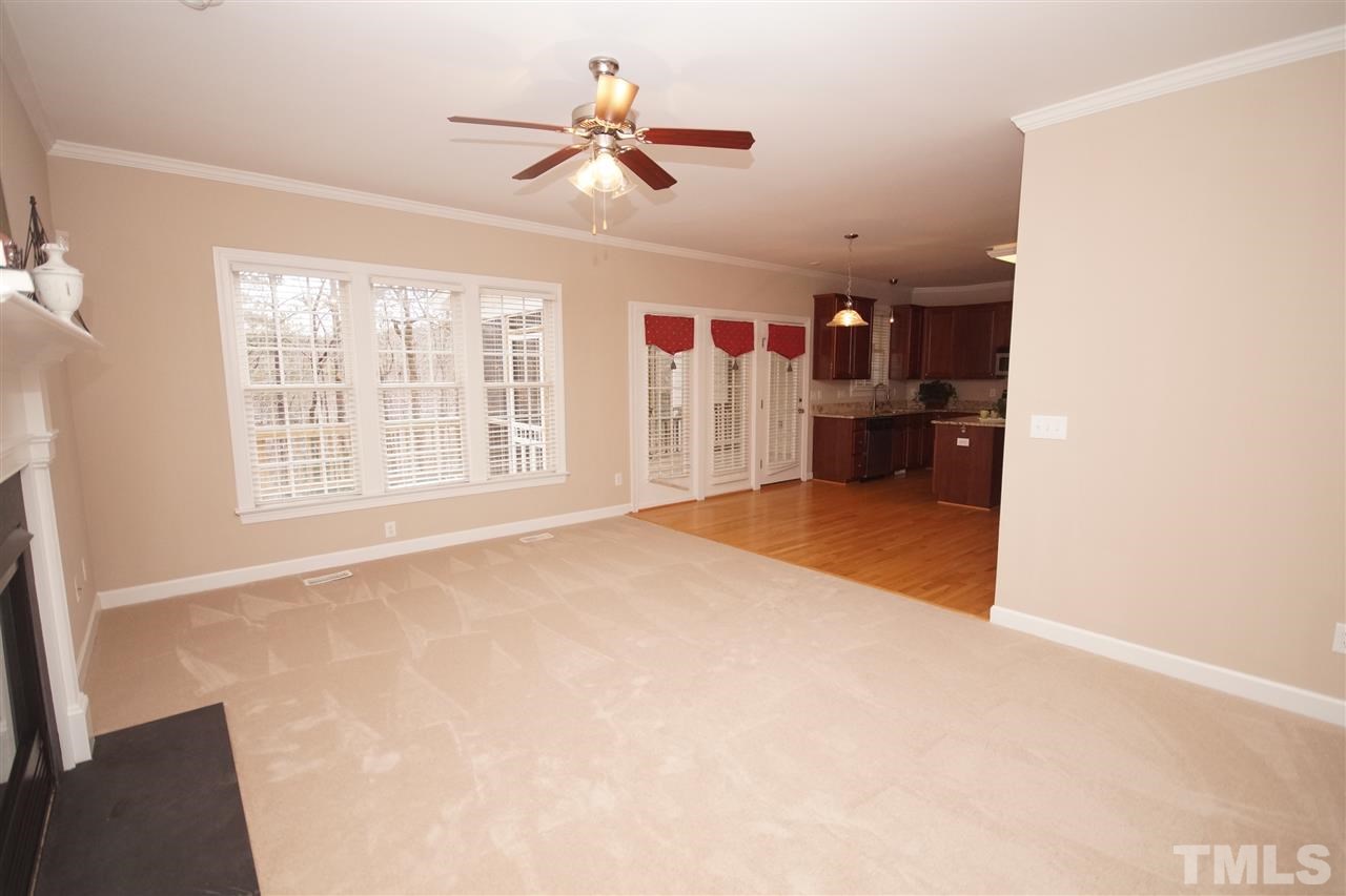 12736 Amoretto Way Raleigh, NC 27613 - Photo 6 of 25 a view of a livingroom with a ceiling fan and window