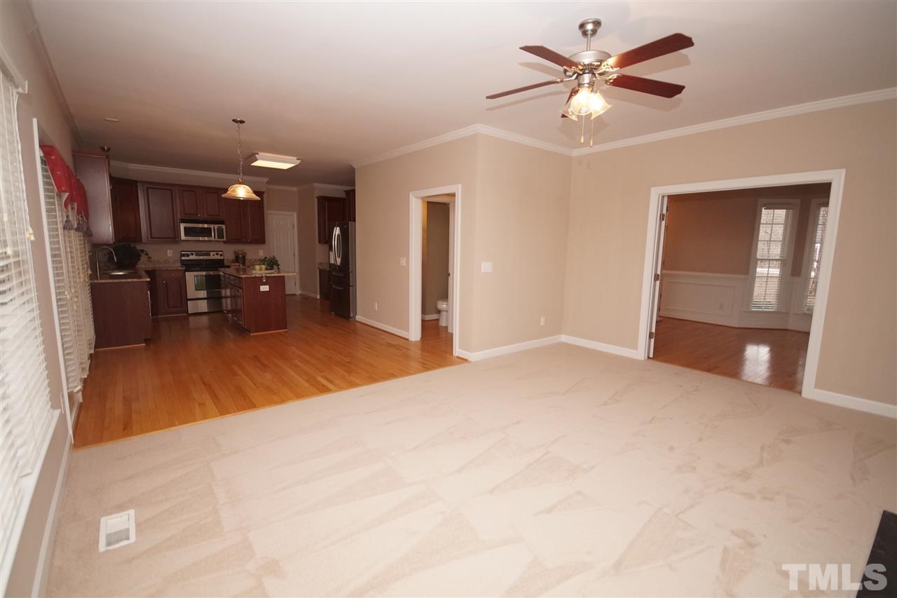 12736 Amoretto Way Raleigh, NC 27613 - Photo 7 of 25 a view of a livingroom with furniture and a ceiling fan