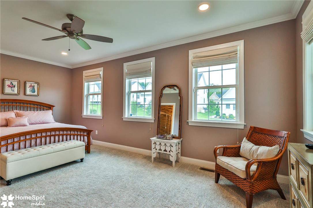4473 Old Saucon Road Bethlehem, PA 18015 - Photo 13 of 26 Plentiful windows fill this bedroom with natural light while illuminating the soft carpeting.