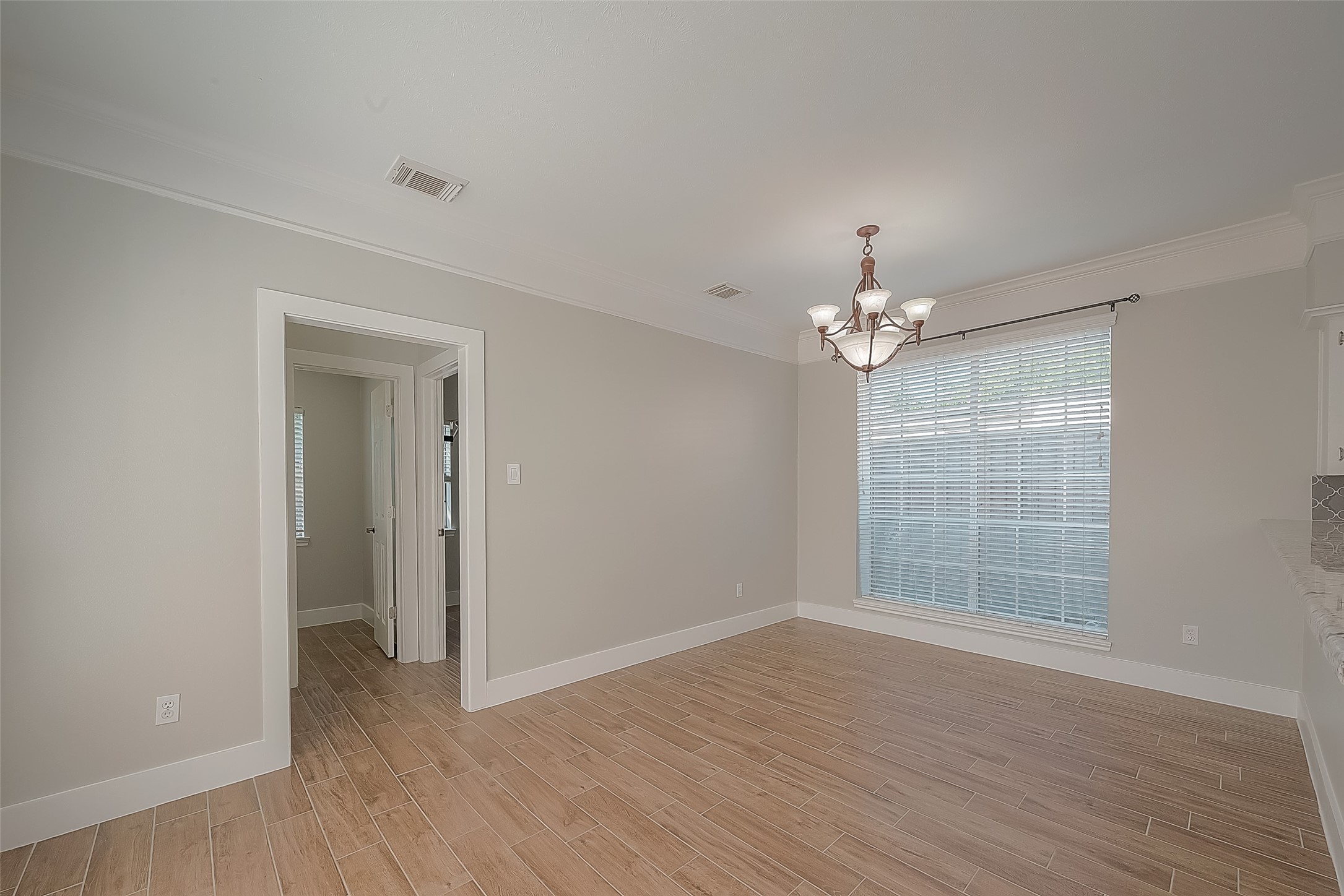 8910 Bonnyview Drive Houston, TX 77095 - Photo 13 of 31 wooden floor in an empty room with a window