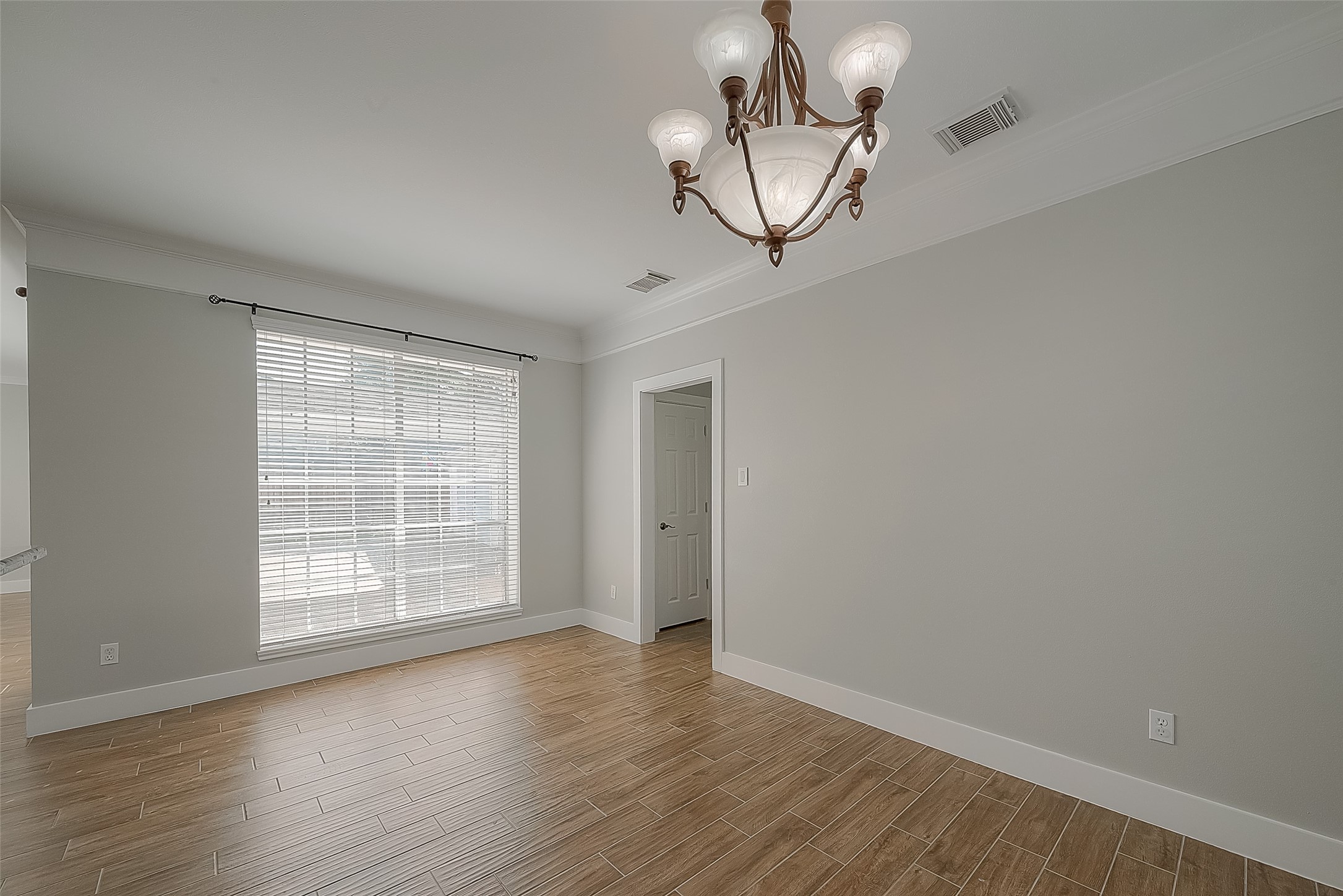 8910 Bonnyview Drive Houston, TX 77095 - Photo 14 of 31 wooden floor in an empty room with a window