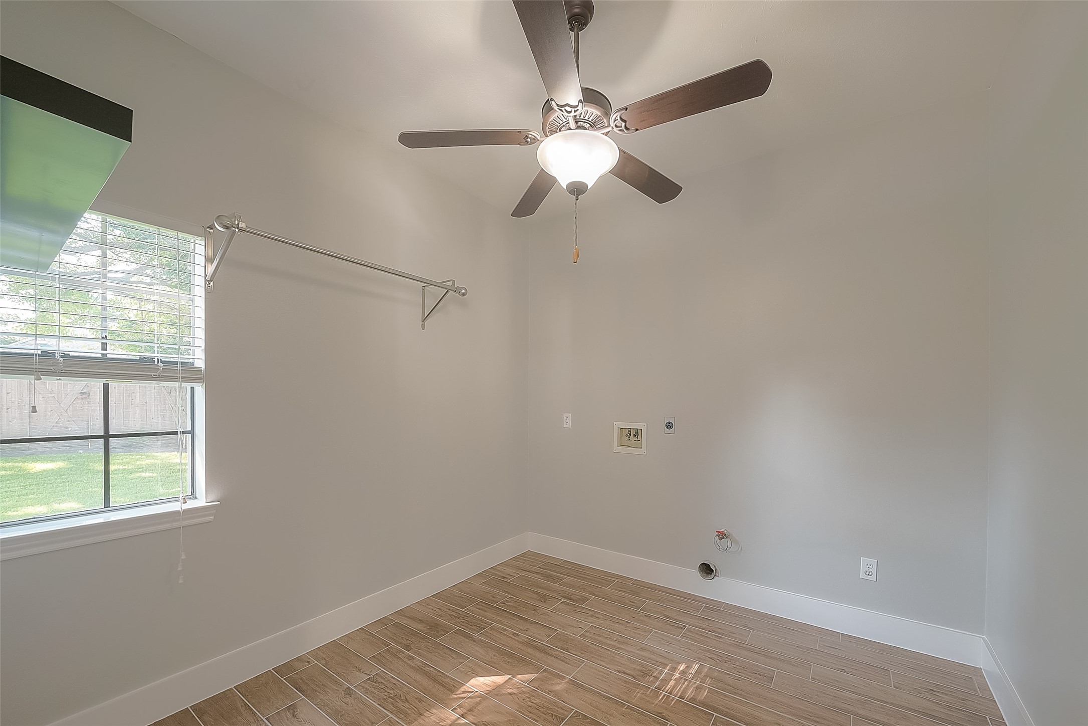8910 Bonnyview Drive Houston, TX 77095 - Photo 15 of 31 a view of a small space with a window and a fan