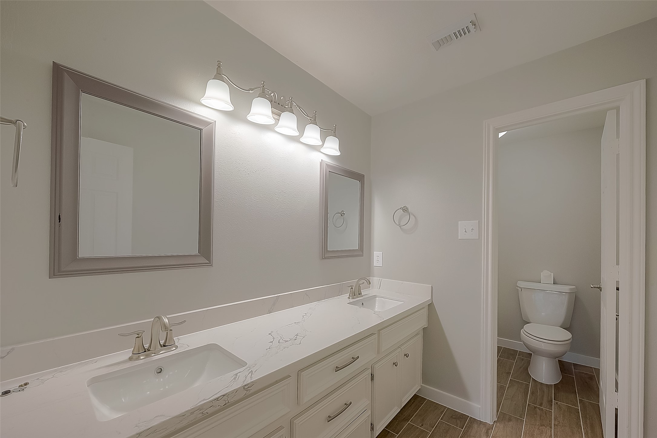 8910 Bonnyview Drive Houston, TX 77095 - Photo 25 of 31 a bathroom with a sink double vanity and a toilet